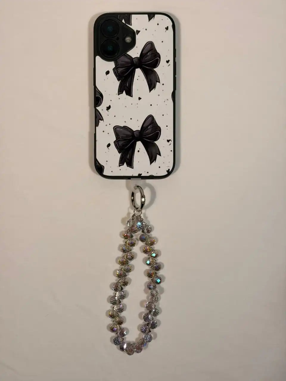 Silver crystal phone charm on a phone