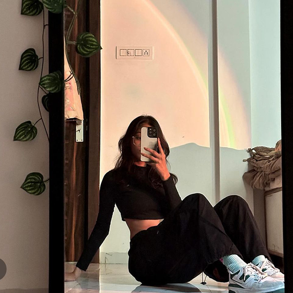 PhoneAntics customer photo of printed phone case, taken indoors with rainbow-tinted light