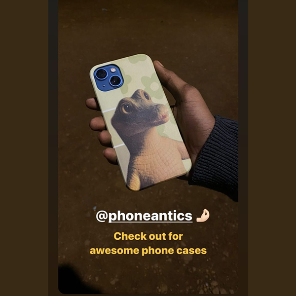 PhoneAntics phone case with custom dinosaur photo print, held by customer