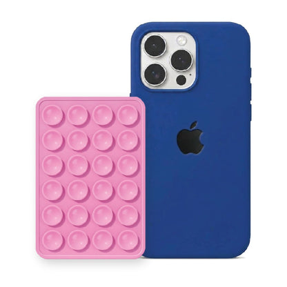 iPhone 16 Pro Liquid Silicone case in Royal Blue with a Light Pink suction phone holder